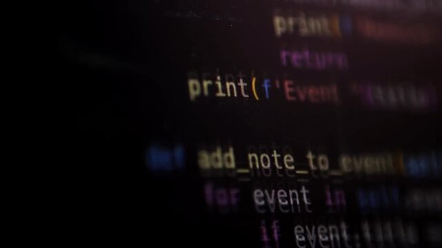 Software Developer Coding Python and AI Chat Bot on Computer Screen