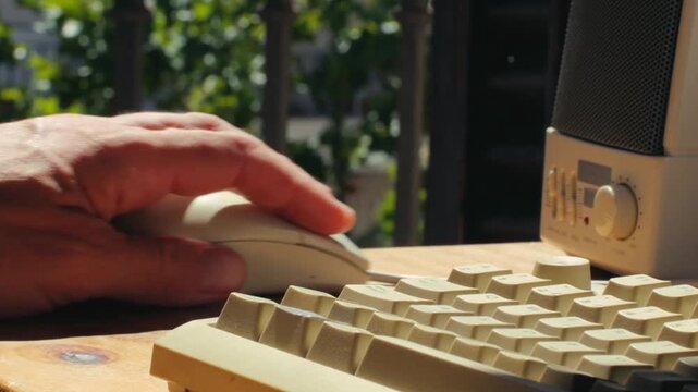 Close Up of Man Working and Gaming on Vintage Retro Computer