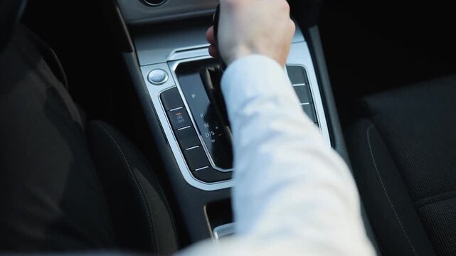 Driver Changing Gear and Using Handbrake Inside Car