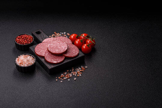 Slices of smoked salami or pepperoni for making sandwiches or pizza at home. Sausage slices