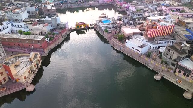 A drone takes off vertically over the sacred lakes of Radha Kunda and Shyama Kunda in Govardhana, Vrindavan
