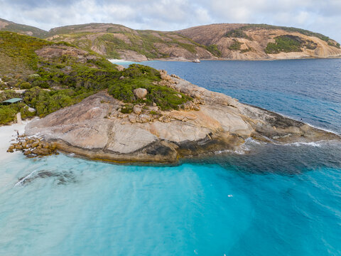 Aerial view of the turquoise waters of Hellfire Bay, featuring granite rock formations and white sandy beaches in Cape Le Grand National Park, Western Australia, Australia.