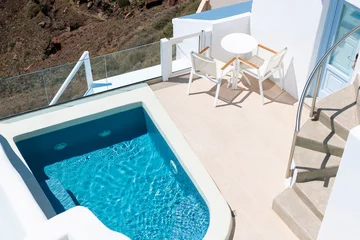 White architecture in Santorini island, Greece..Beautiful terrace with swimming pool. © smallredgirl