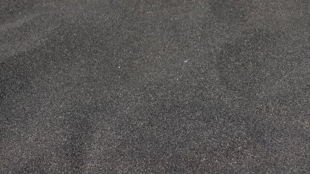 Black sand beach with crashing waves on the south coast
