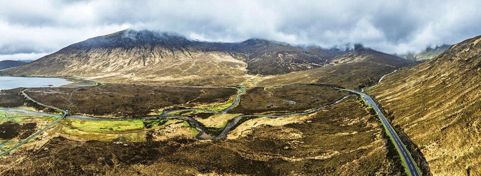 Panorama of Eas a' Bhradain Waterfall from drone, Red Cuillin mountains, Loch Ainort, Isle of Skye, Scotland, UK