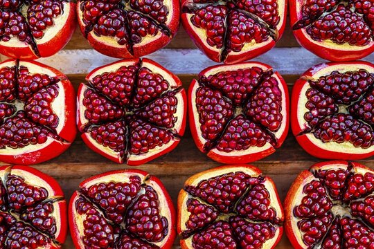 Pomegranate (Punica granatum), halved with red seeds, fruit, food, stand at the Asiatic Riverfront, Bangkok, Thailand's metropolis, Thailand