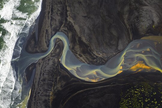 Interwoven river with colourful sediments, South Iceland, Iceland