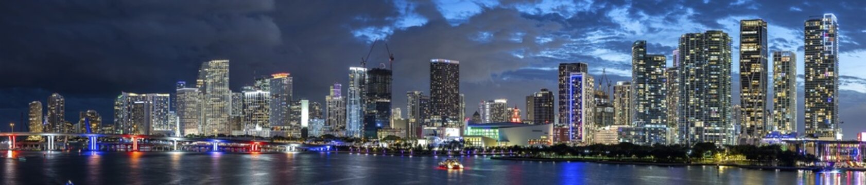 Miami skyline with high-rise real estate in downtown ocean panorama at night in Miami, USA