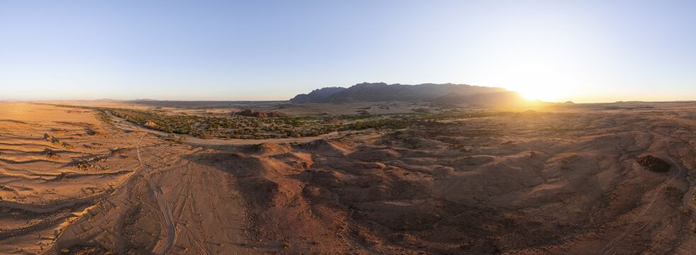 Aerial view, dry riverbed and desert landscape on the Ugab River, behind Brandberg, Erongo, Damaraland, Namibia