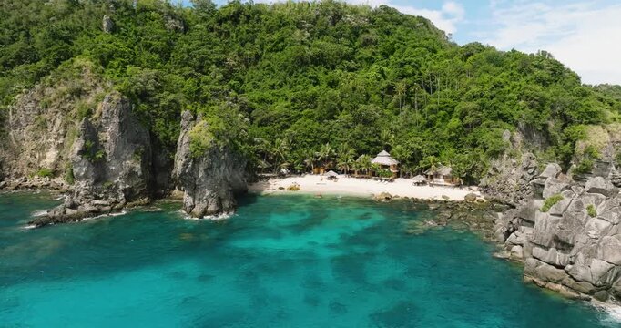 Top view of island with sandy beach and coral reef. Apo Island. Negros, Philippines.