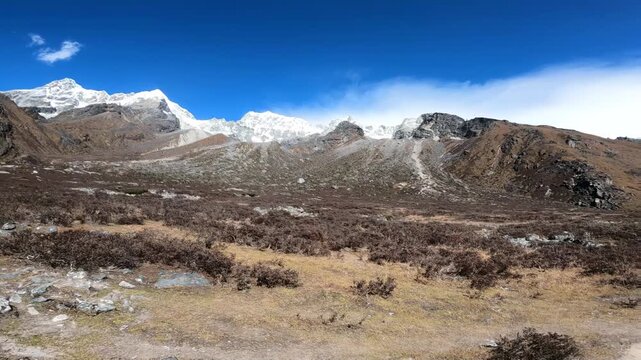 Panoramic mountain view with the clear blue sky. This video was captured during the Kanchenjung circuit trek in Nepal.