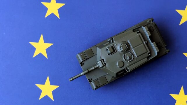 A tank on the European Union flag as a conceptual backdrop representing Europe's defense