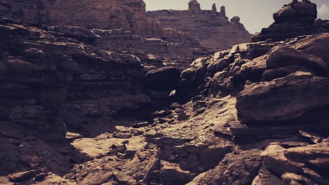 geological strata and eroded canyon, layered sedimentary rock and exposed outcrops with textured beds and weathered cliffs, fieldwork atmosphere suggesting