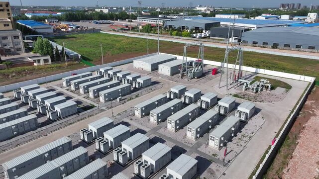 Aerial view of large-scale energy storage station with battery container arrays