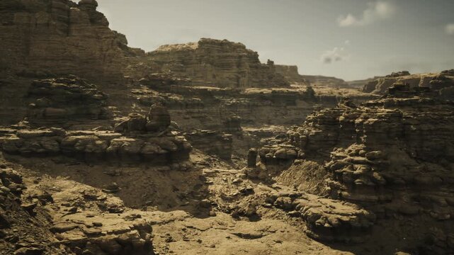 Remote geological survey at eroded canyon showing exposed strata and sediment layers ideal for mapping sampling and remote sensing studies under harsh sun