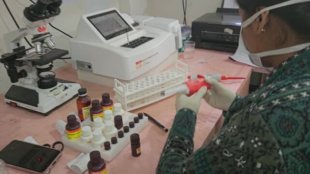 Laboratory Technician Using Micropipette for Clinical Sample Preparation in Modern Medical Laboratory, Scientific Research, Diagnostic Testing, Biotechnology, Healthcare, 4K Stock Footage