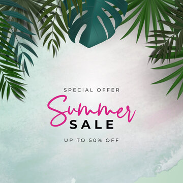Tropical palm leaves frame with summer sale text on a pastel pink background