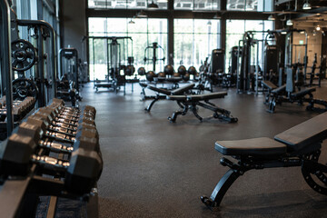 Fototapeta premium Modern Gym Interior Background with Fitness Equipment and Luxury Wellness Club Atmosphere