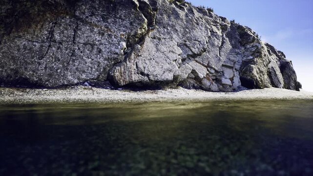 Closeup of Los Gigantes rock base, cracked limestone texture, strip of pebble beach, shallow greenish water, cool midday tones, raw tactile feel.