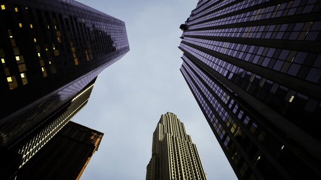 Cluster of city towers forming dramatic skyline crescendo, central historic crown punctuates modern glass, cool sky and illuminated windows give dynamic urban