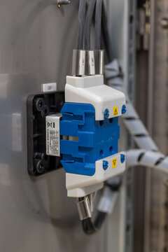 Close-up of the rear part of the main switch on an electrical cabinet.