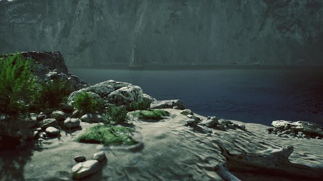 Twilight rocky bay with calm water and low cliff, foreground pebbles and coastal vegetation under muted light, quiet atmosphere with distant cliff silhouette