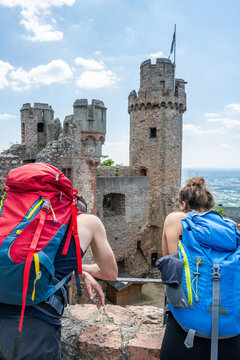 People hiking odenwald viewing auerbach castle ruins