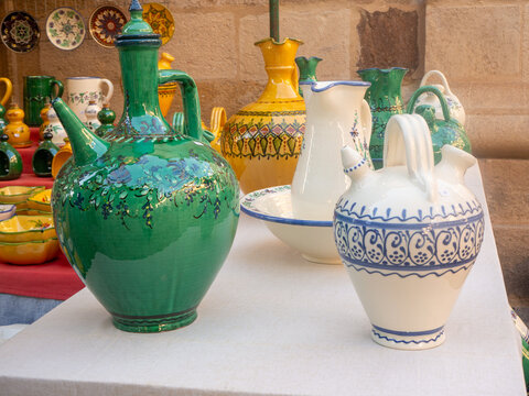 Traditional ceramic pottery displayed at artisan market stall