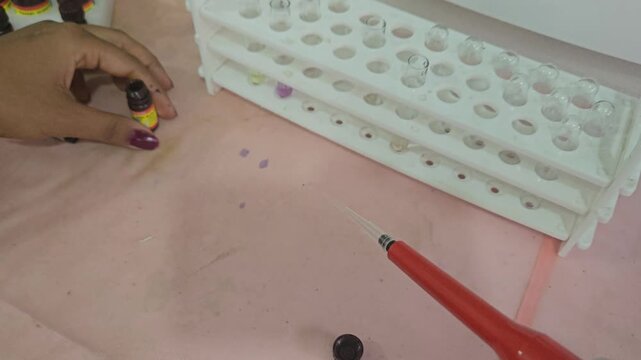 Laboratory Technician Performing Clinical Chemistry Sample Preparation with Micropipette and Reagents in Modern Medical Laboratory, Diagnostic Testing, Biotechnology, Healthcare Research, 4K Footage