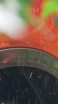 Hand of car owner wipes dirt from red surface with yellow sponge. Clear water washes away stains, leaving smooth finish. Focus on keeping car exterior clean and in excellent condition