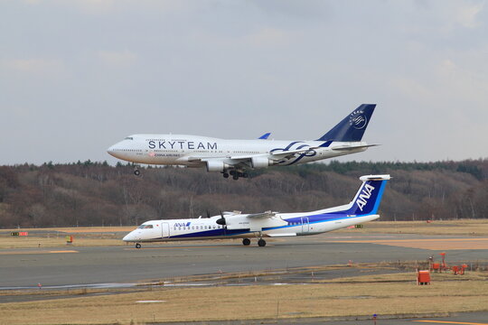 A commercial airliner on approach to New Chitose Airport against a blue sky on November 29, 2017 in New Chitose, Japan.
