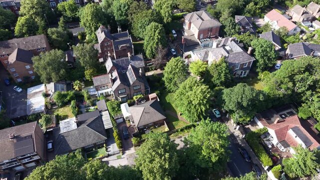 Aerial drone 4K footage showing Wirral housing estates glowing under intense midday sunlight with bright natural tones across the neighbourhood Wirral