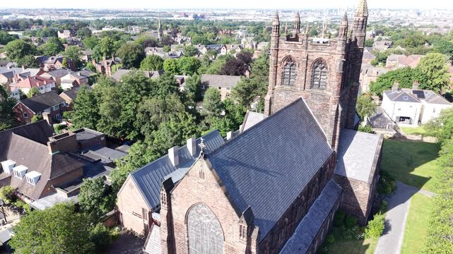 Aerial drone 4K clip showing long rows of Wirral homes lit by bright daylight Wirral