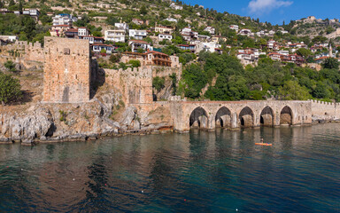Fototapeta premium Historic Seljuk Shipyard of Alanya on Mediterranean Coast, Antalya, Turkey – Aerial Drone View