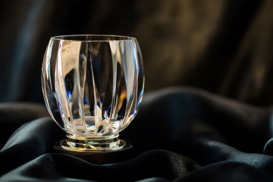 Crystal trophy on black cloth with elegant clear glass award and soft reflection