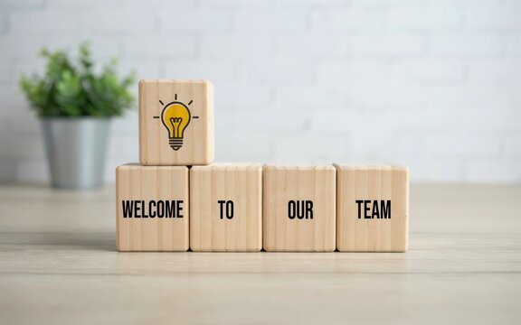 Wooden blocks with the words welcome to our team