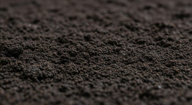 Extreme Close-up Macro Texture of Dark Gritty Soil Surface