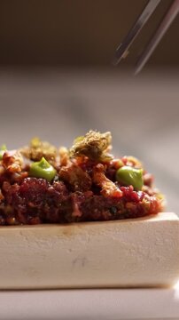 Beef tartare served in a fine dining restaurant, close-up gourmet appetizer
