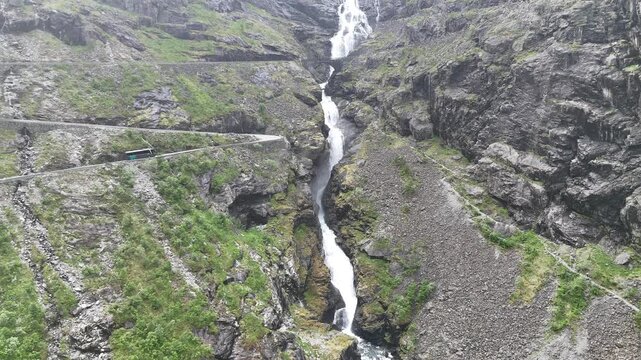 Aerial drone pan up over Stigfossbrua at lower Trollstigen, Norway