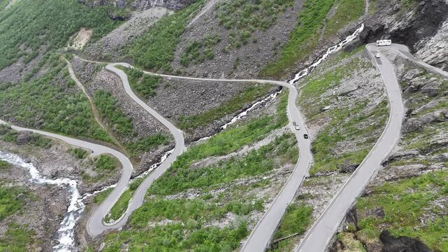 Aerial drone pan up over Stigfossbrua at lower Trollstigen, Norway