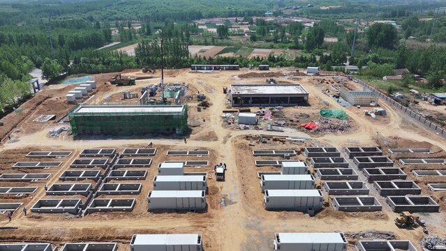 Aerial view of large-scale energy storage power station construction site with battery modules and infrastructure
