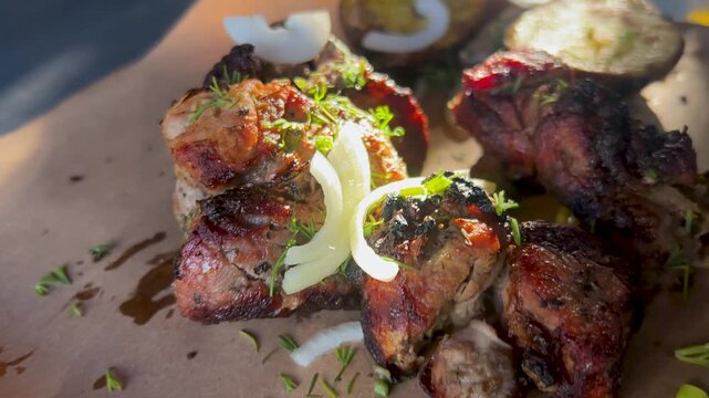 Delicious pork shashlik. Grilled meat, pieces with onions and dill. Caucasian barbecue.