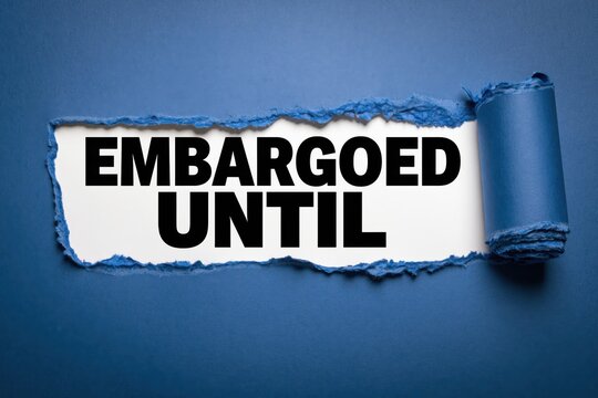 Conceptual text embargoed until shown behind torn dark blue paper