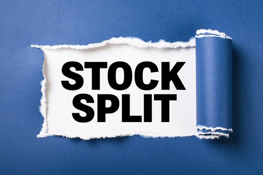 Conceptual words stock split written on white paper under torn dark blue paper