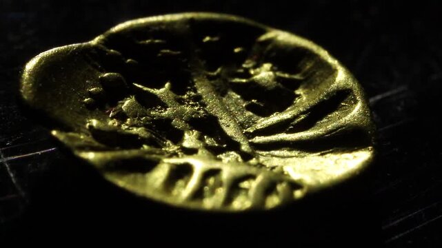 Celtic stater with abstract motifs. Archeological find. Gold Boii tribe prehistoric coin. One 24th of a stater.