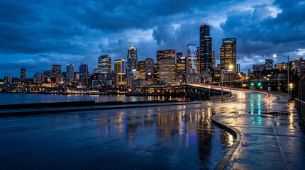 Fototapeta premium ​Seattle skyline at night with motion blur traffic lights and reflection on wet street after rain