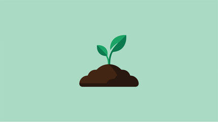 Fototapeta premium A small green plant sprout growing from fertile soil.
