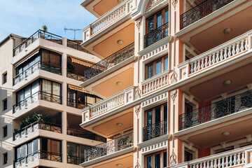 Fototapeta premium Monaco, Monaco - June 6, 2026: Contrasting residential apartment buildings showcase contemporary and Belle Époque architecture during Monaco Grand Prix qualifying weekend