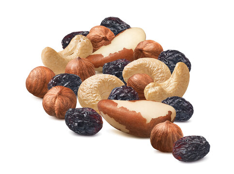 Group of brazil nuts, hazelnuts, cashew and raisin isolated on white background. Real photography.