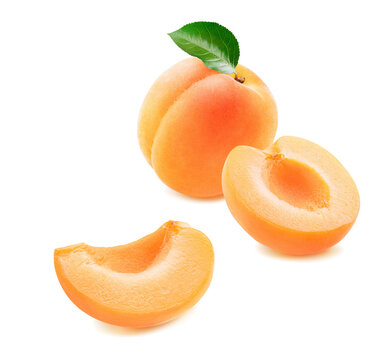 Whole apricot and pieces isolated on white background. Real photography